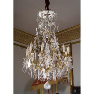 Lustre Louis XV en cristal et bronze doré à neuf bras de lumière