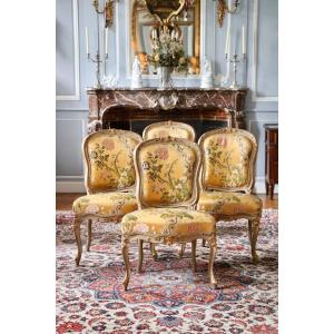 Suite de quatre chaises laquées gris rechampies estampillée Burgat