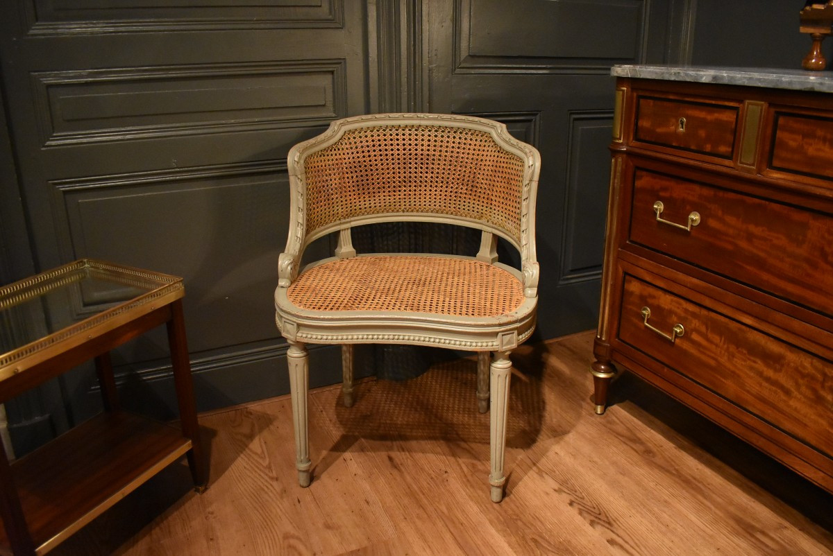 Fauteuil de bureau canné de style Louis XVI  