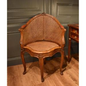 Fauteuil de bureau canné de style Louis XV