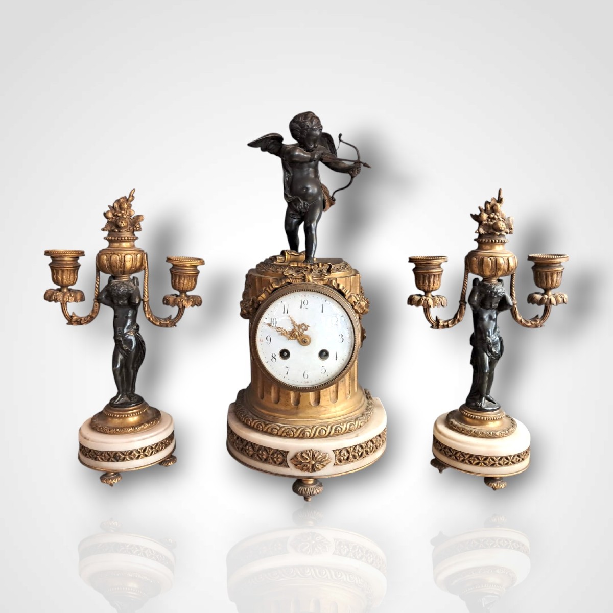 Clock And Pair Of Candlesticks With Cherubs, 19th Century