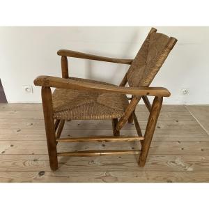 Fauteuil paillé par  Charlotte Perriand modèle Chamrousse édition Steph Simon 1960.