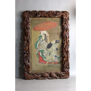 Grand cadre sculpté avec sa peinture asiatique