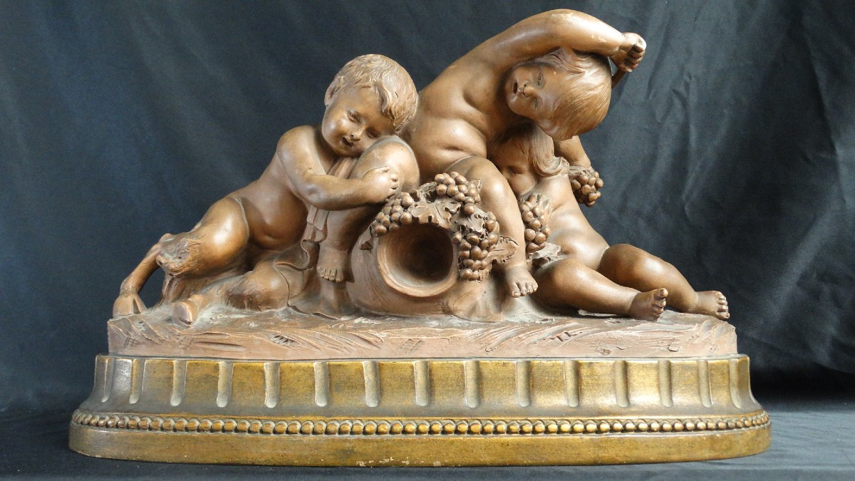 " Putti  et faune à la grappe de raisins"  terre-cuite de Calendi
