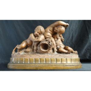 " Putti  et faune à la grappe de raisins"  terre-cuite de Calendi
