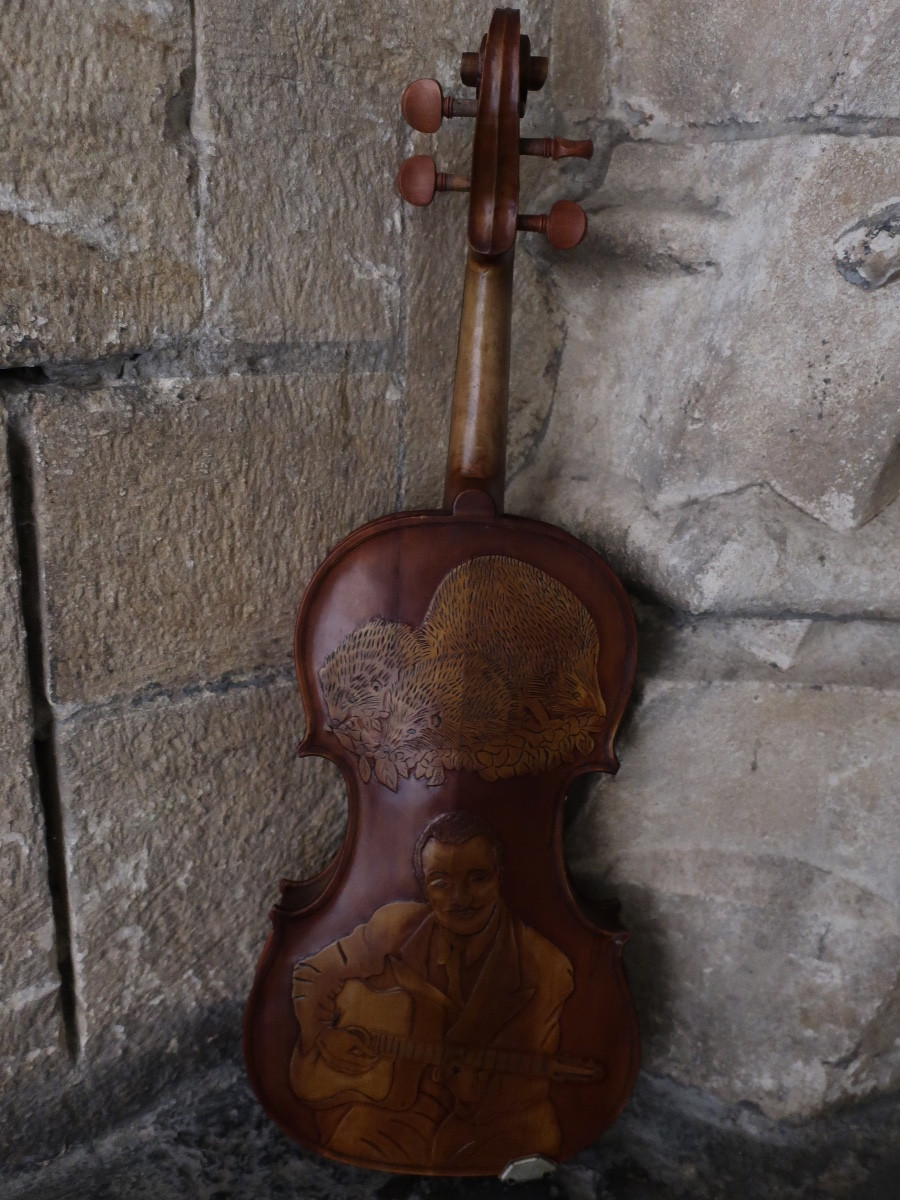 Violin Carved With The Image Of Django Reinhard. Musical Instrument