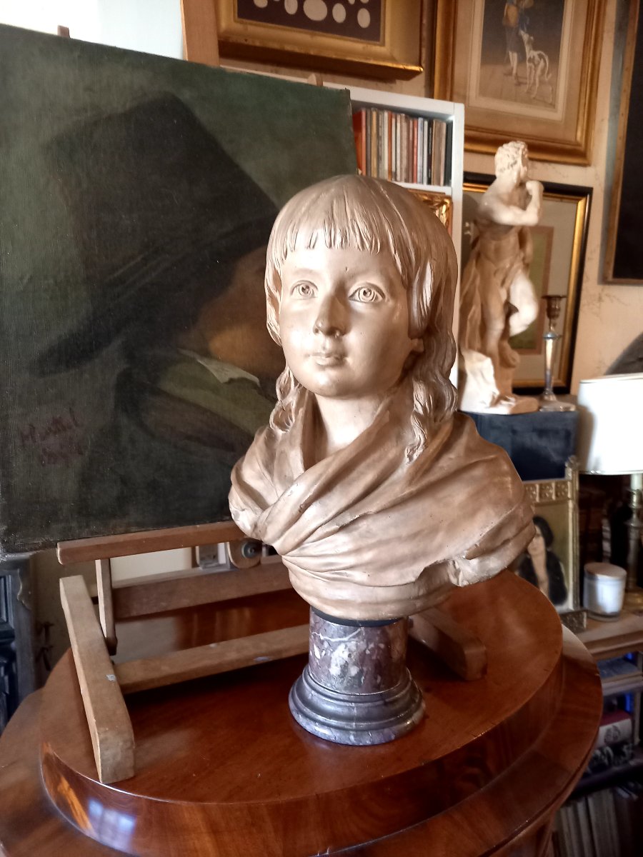 D'après Houdon,  ,  buste du Dauphin de France Louis XVII en terre cuite 