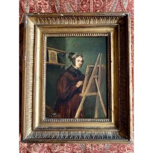 Une jeune femme peintre à son chevalet 