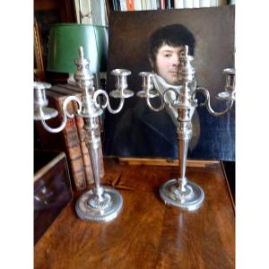 Paires de chandeliers directoires en métal argenté