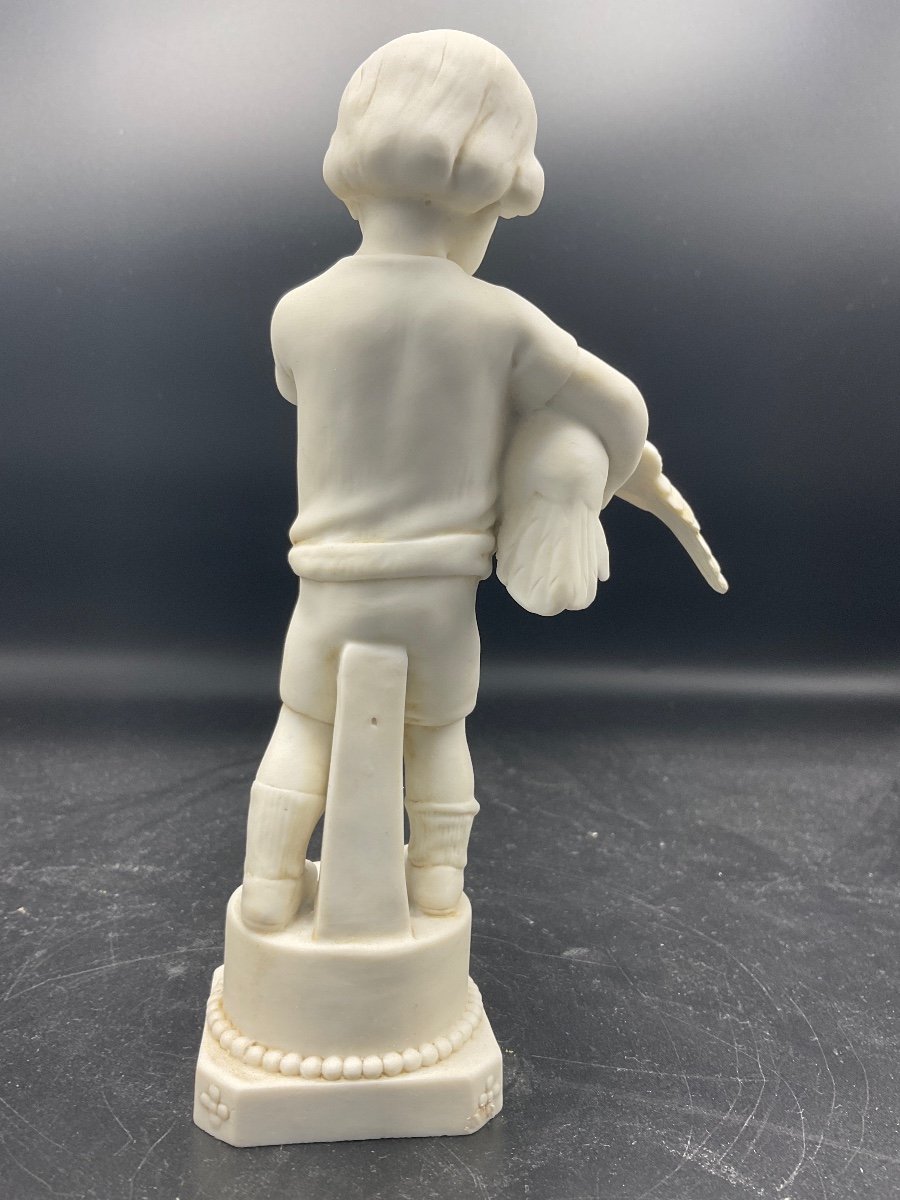 Biscuit From The Müller Factory Located In The Thuringia Region In Germany Representing A Boy With A Hen In His Arms.-photo-3