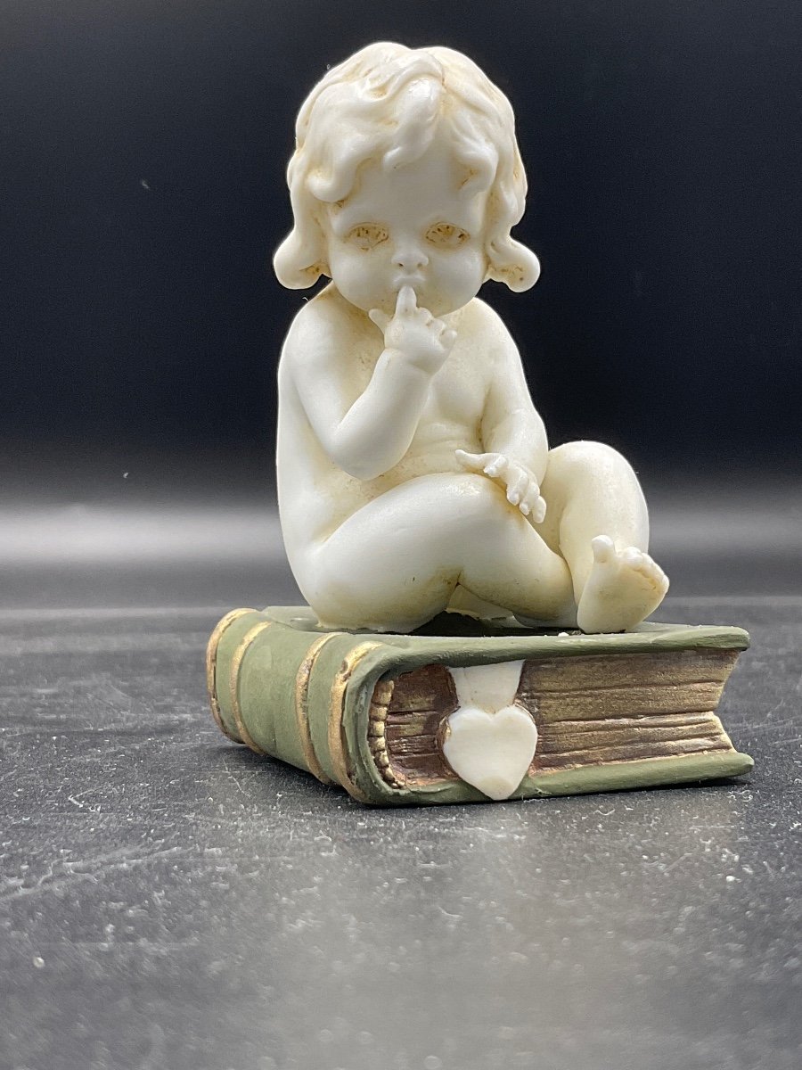 Biscuit From The Müller Factory Representing A Little Girl Sitting On A Book.-photo-3