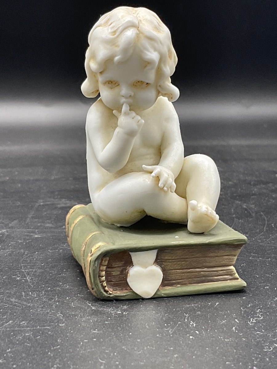 Biscuit From The Müller Factory Representing A Little Girl Sitting On A Book.-photo-4