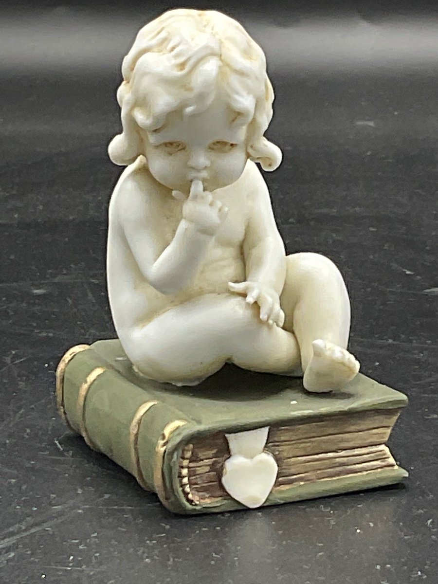 Biscuit From The Müller Factory Representing A Little Girl Sitting On A Book.-photo-8