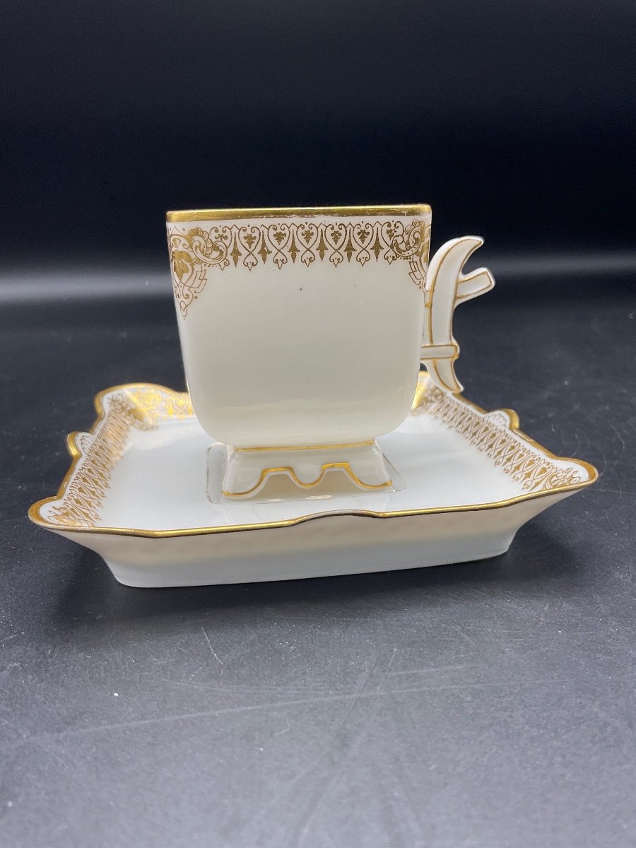 A Cup And Its White And Gold Saucer In Limoges Porcelain From The Jean Pouyat Factory Of The Mercédès Service.