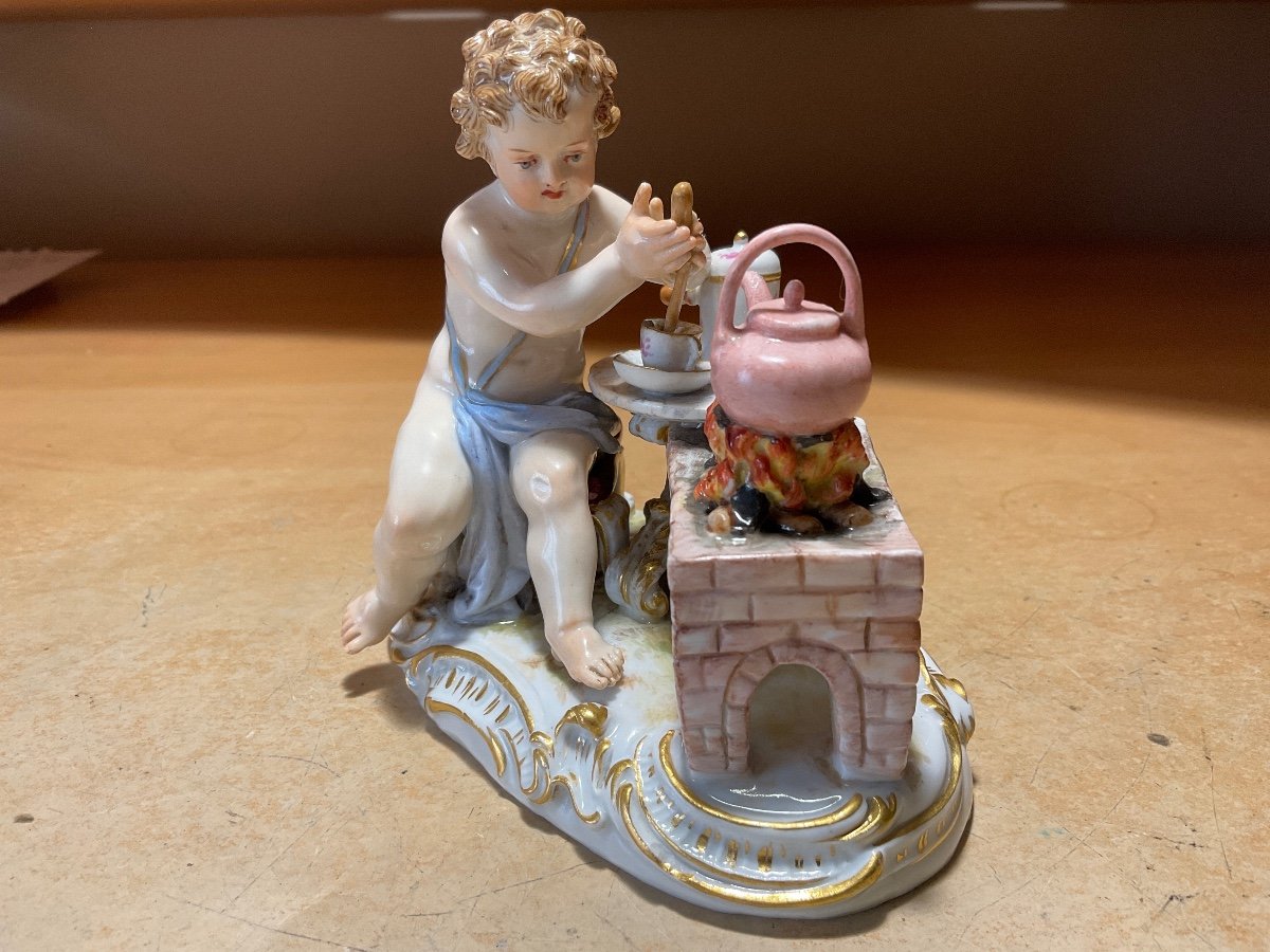 Polychrome Meissen Porcelain Representing A Putti Preparing His Chocolate.