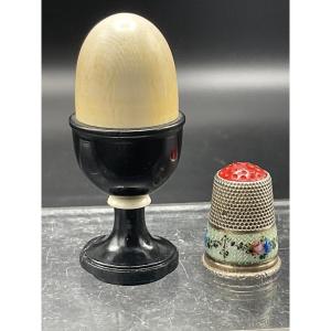 Thimble Door Representing An Ebony Eggcup And Ivory Ring And Its Egg In Ivory.