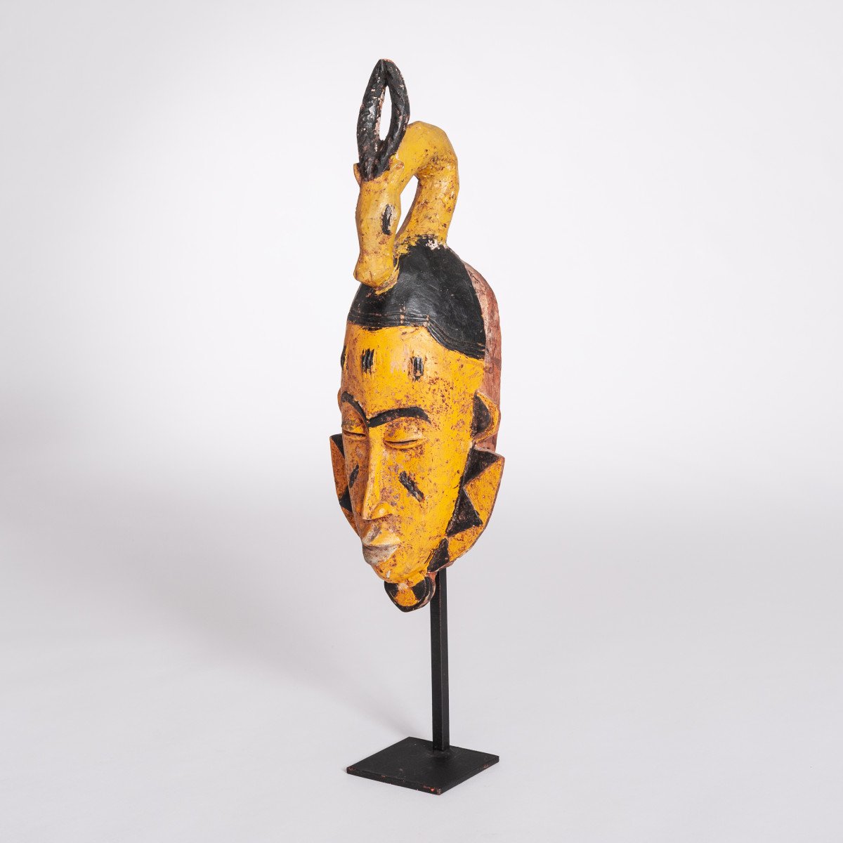 Mid-century Baoule Tribal Mask In Yellow-black With Antelope Head Decoration