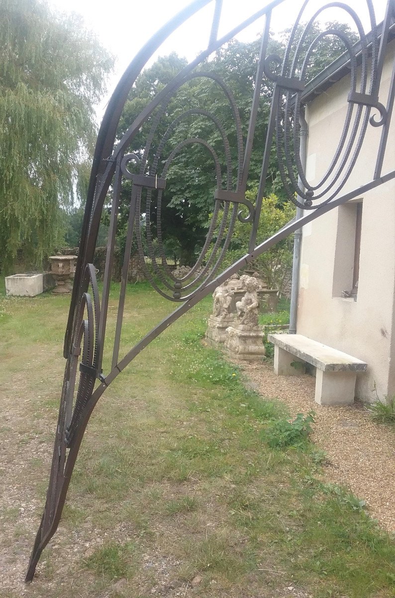 Burgundy Stone Staircase With Wrought Iron Handrail-photo-2