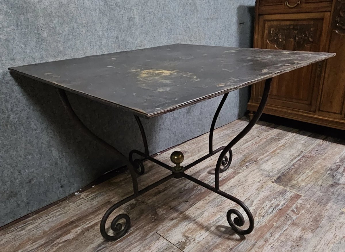 Wrought Iron Table With Sculptural Base, Adorned With Scrolls And A Central Brass Element. -photo-3