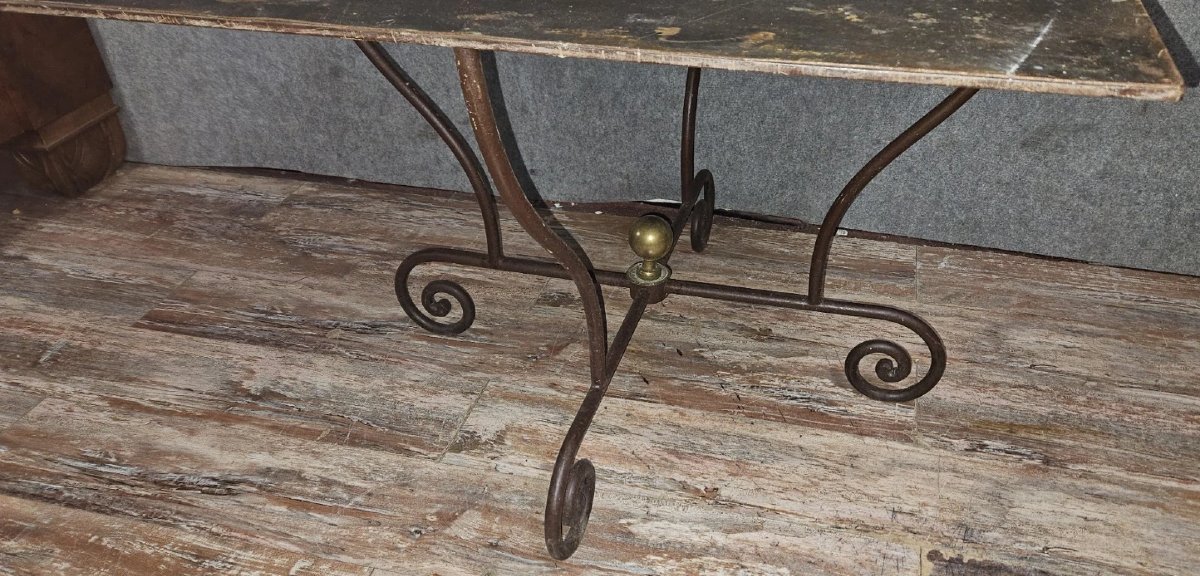 Wrought Iron Table With Sculptural Base, Adorned With Scrolls And A Central Brass Element. -photo-4
