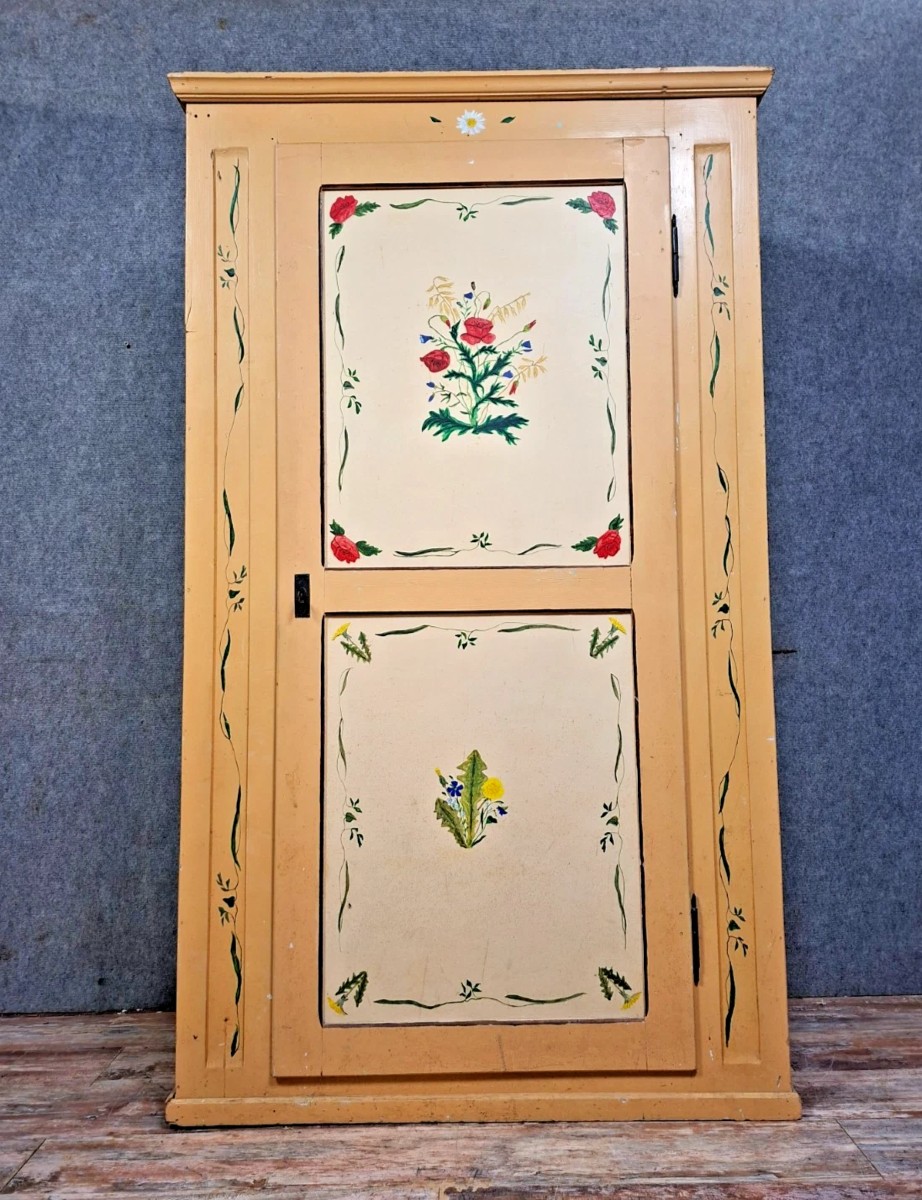 A Traditional Folk-style Cabinet, Made Of Wood And Entirely Painted.