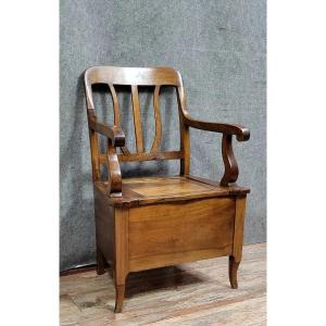 Fauteuil coffre époque Louis Philippe en noyer vers 1830