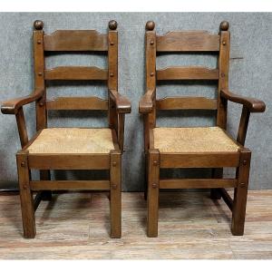 Paire de fauteuils brutalistes en bois massif vers 1950