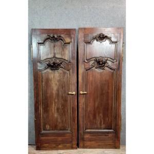 Paire de portes de boiserie de château aux putti 