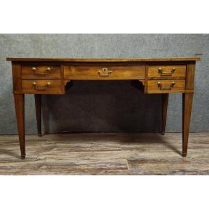 Bureau plat époque directoire en noyer, travail XIXᵉ siècle