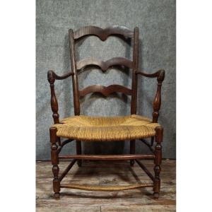 Antique Armchair In Solid Wood With A Woven Straw Seat, In A Rustic/provincial Style.