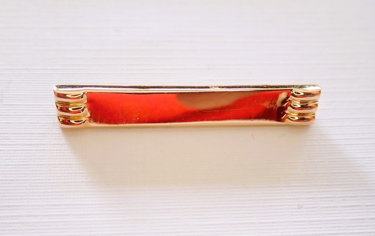 Broche de bavoir bébé or 18 carats