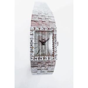 Montre or blanc de marque Jaquet-droz sertie de diamants
