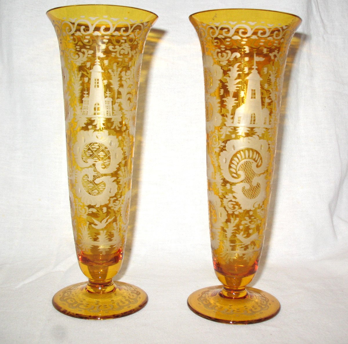 Pair Of Bohemian Amber Glass Vases With Engraved Decoration Of Animals And Castle, 19th Century