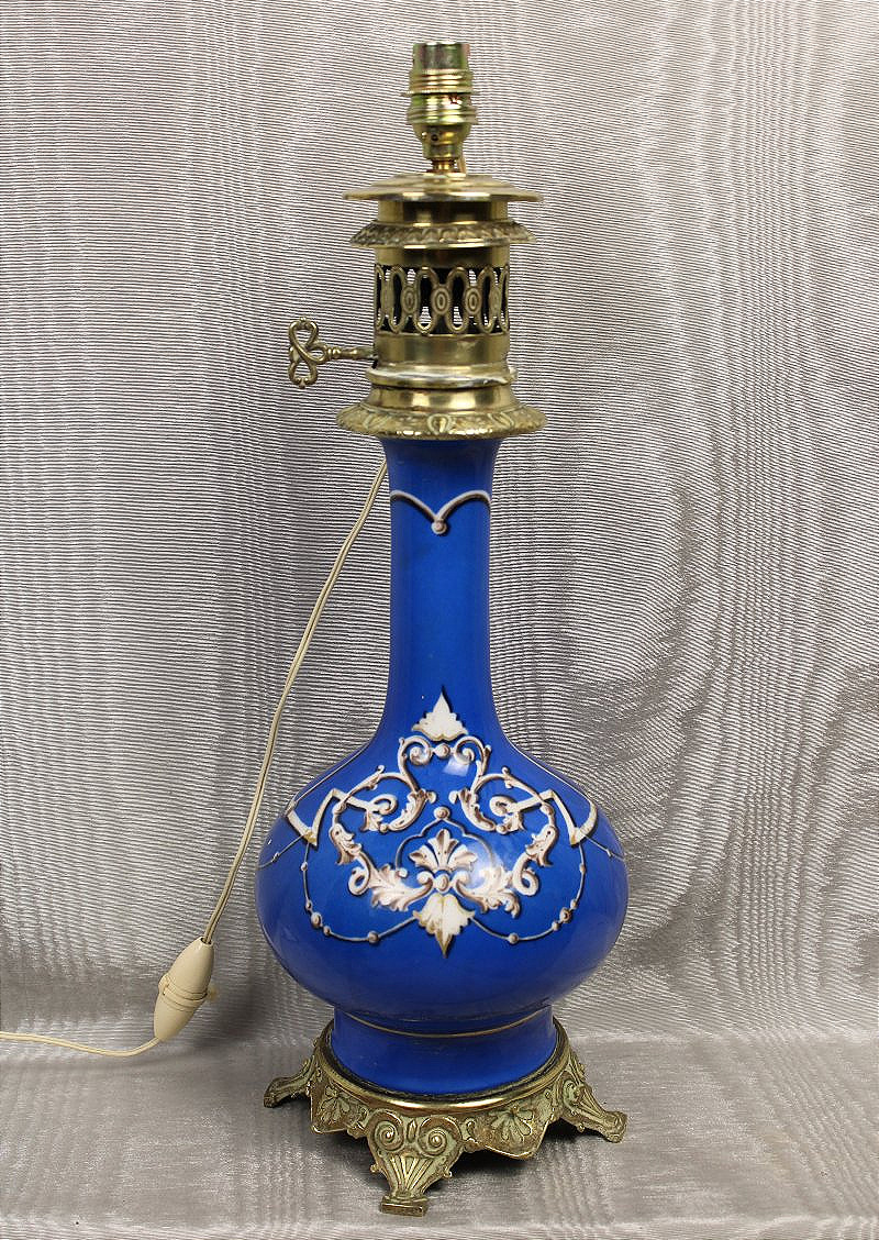 Parisian Porcelain Lamp With Lambrequin Decoration On A Royal Blue Background  Art Nouveau