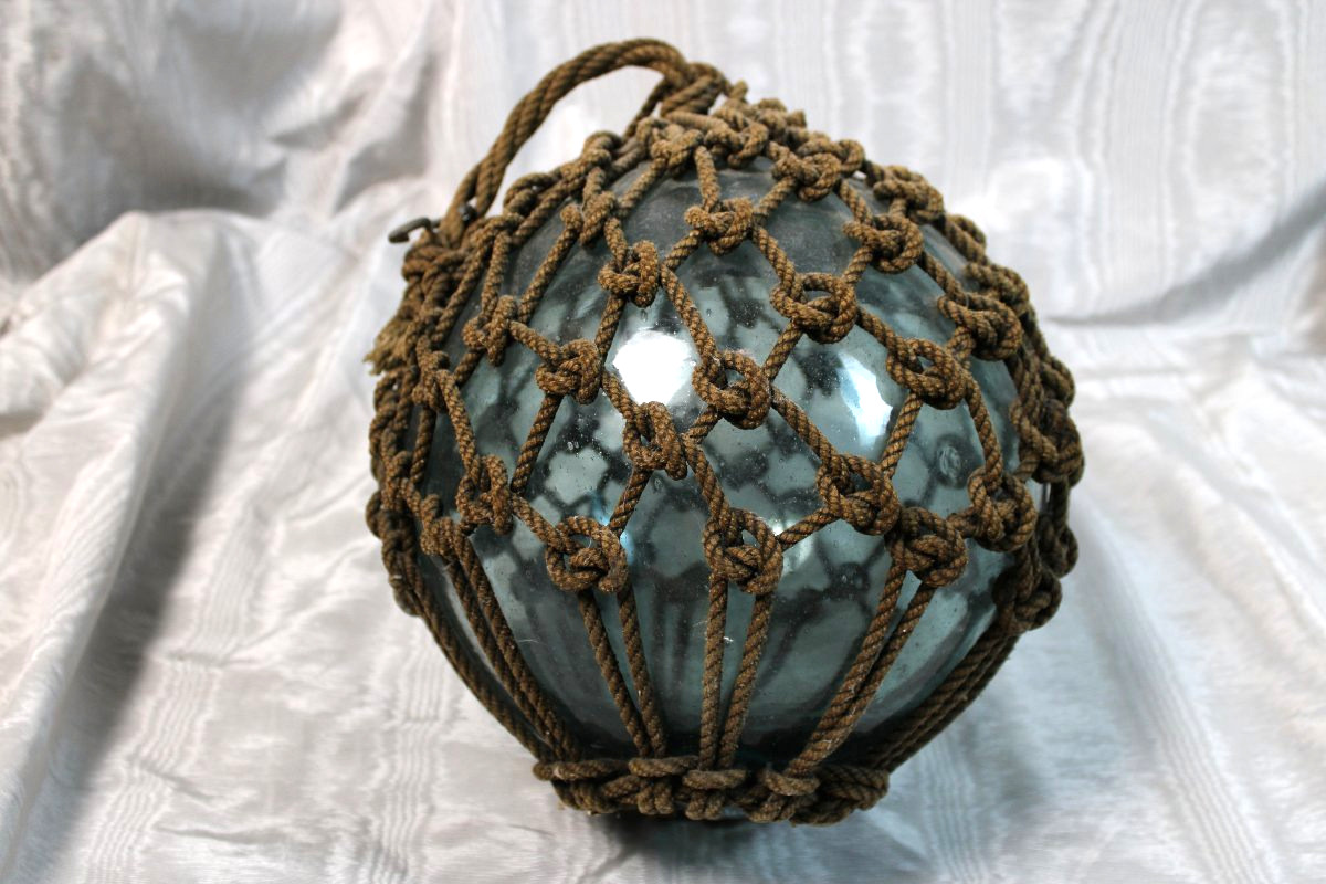 Buoy: A Nautical Artifact Made Of Blown Glass And Rope From The Early 20th Century-photo-1