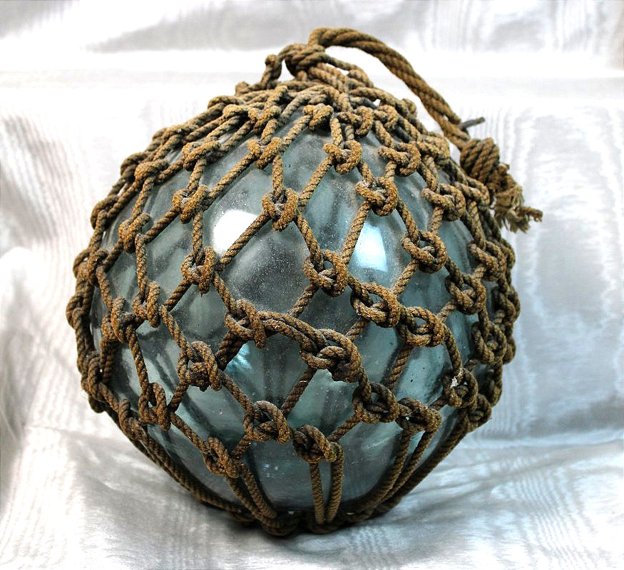 Buoy: A Nautical Artifact Made Of Blown Glass And Rope From The Early 20th Century