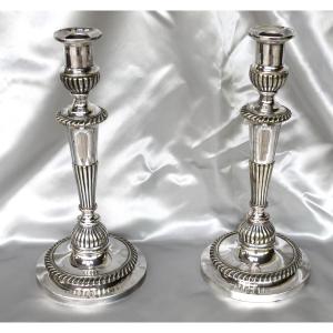 Paire de bougeoirs de style Louis XVI en bronze argenté époque début 19ème