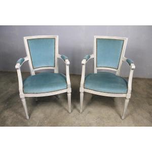 Paire de fauteuils en hêtre rechampi de style Louis XVI époque 20ème
