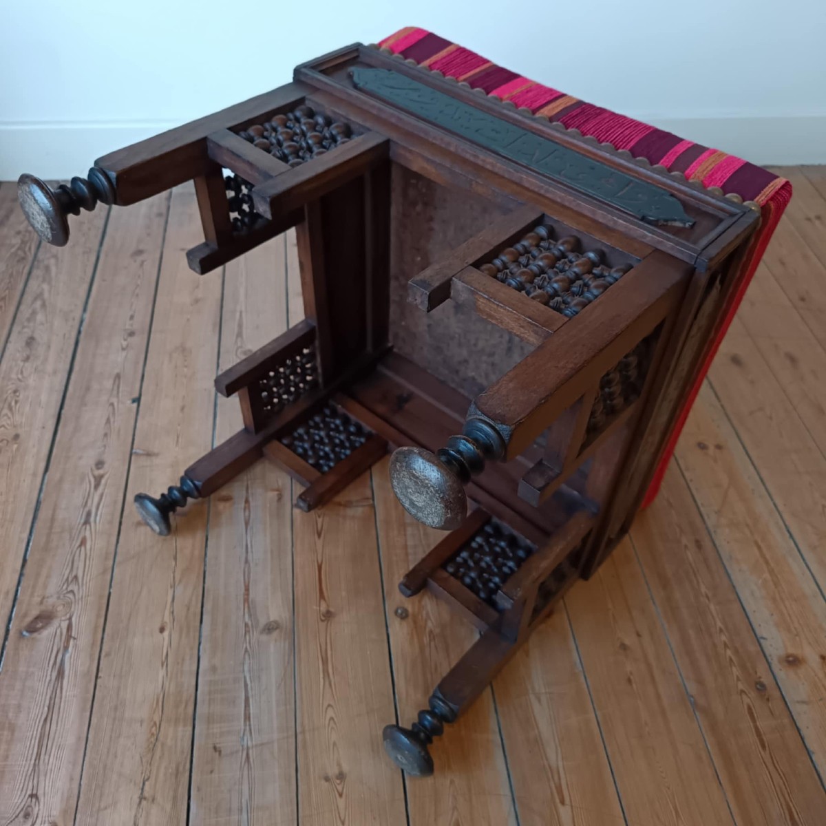 Oriental Stool With Thick Padding In A Striped Fabric Pattern In Shades Of Red-photo-1