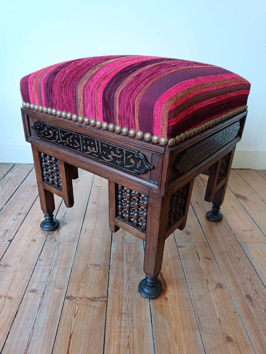 Oriental Stool With Thick Padding In A Striped Fabric Pattern In Shades Of Red