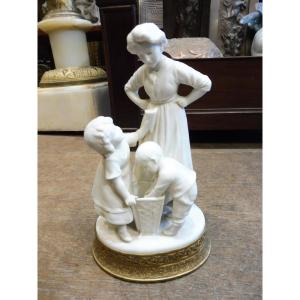 Biscuit Porcelain Group, Circa 1900, On A Gilt Brass Base 
