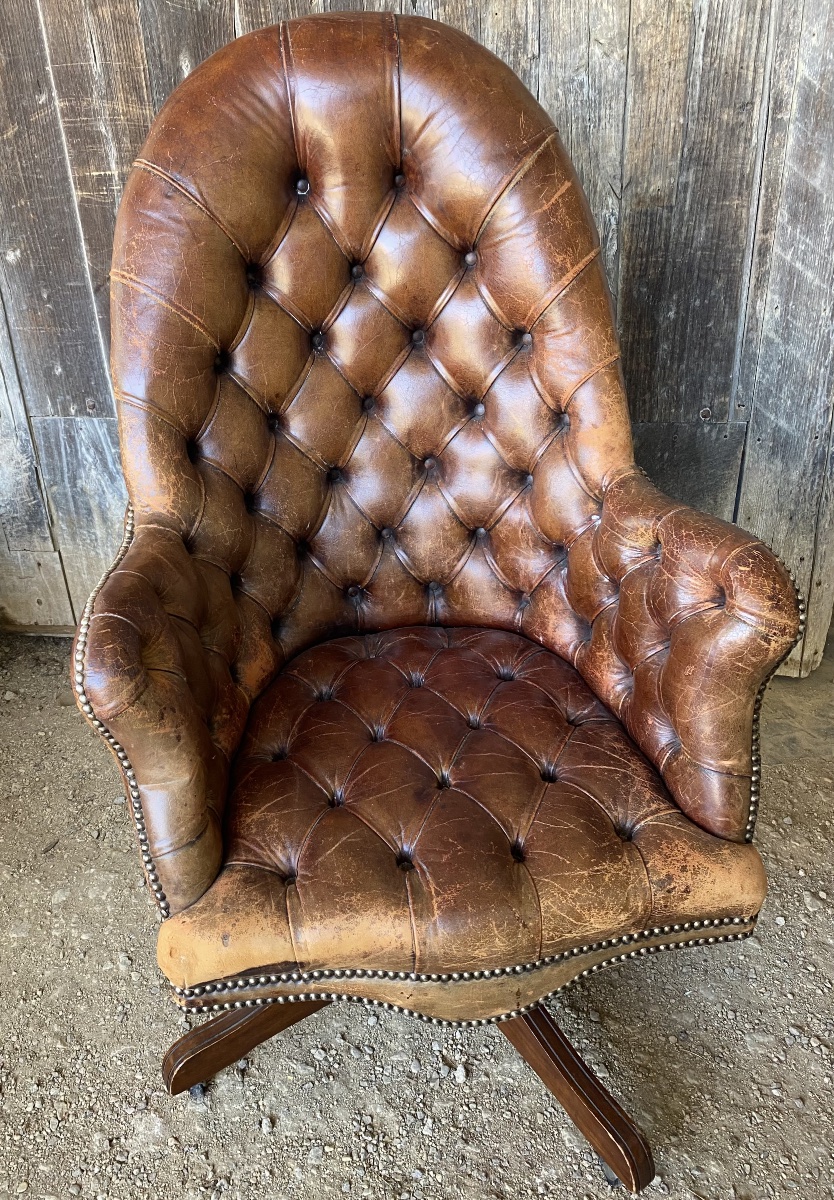 Fauteuil de bureau en cuir capitonné