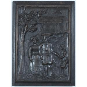 Art polulaire breton XXe s. Bas-relief sur panneau de bois : Aumône à la sortie d'une église