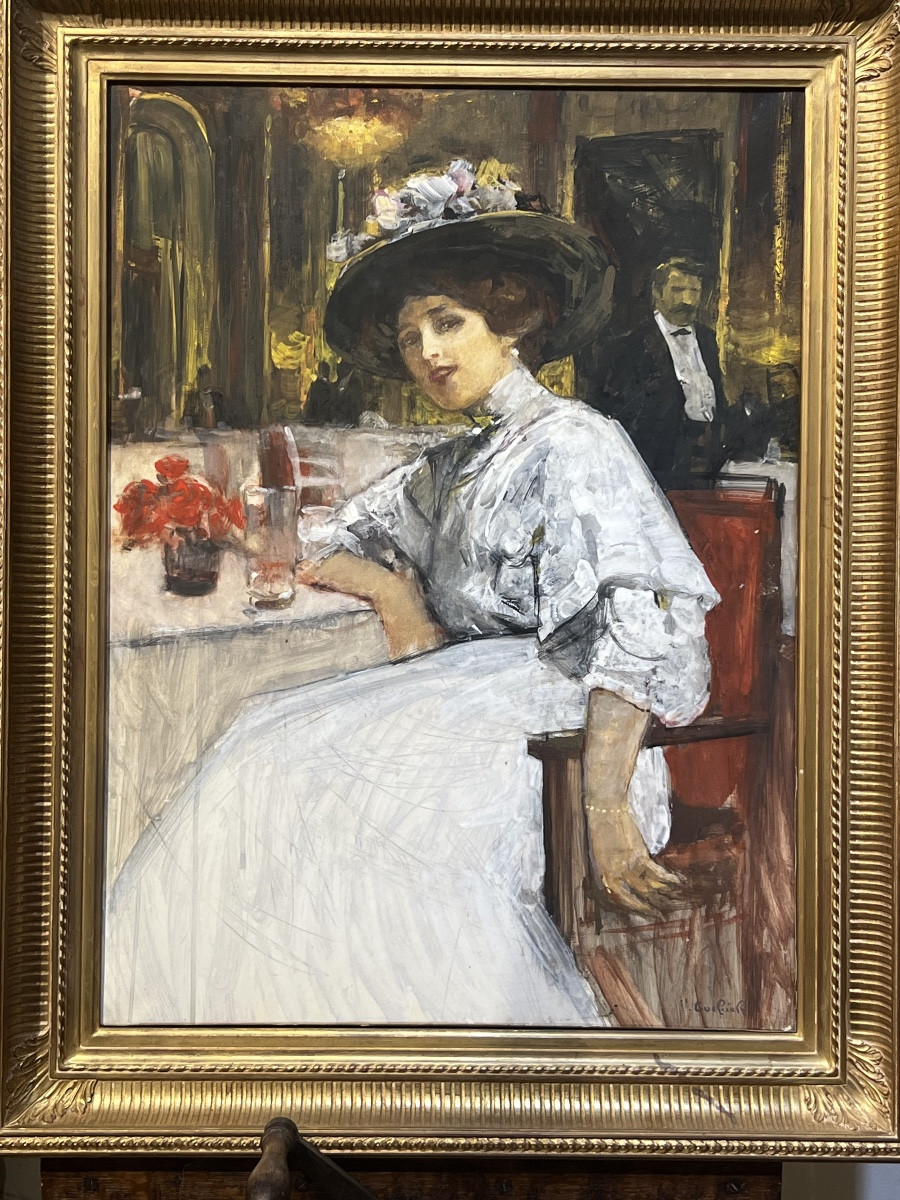 Elegant Woman In A Parisian Brasserie