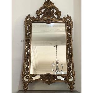 Grand miroir en bois doré 