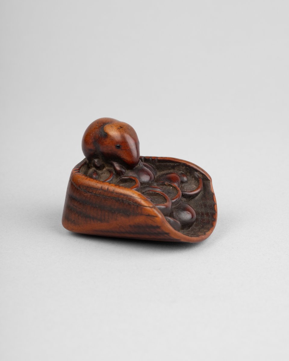 A Carved Boxwood Netsuke Depicting A Basket Filled With Mushrooms And Mice. Edo Period, Japan