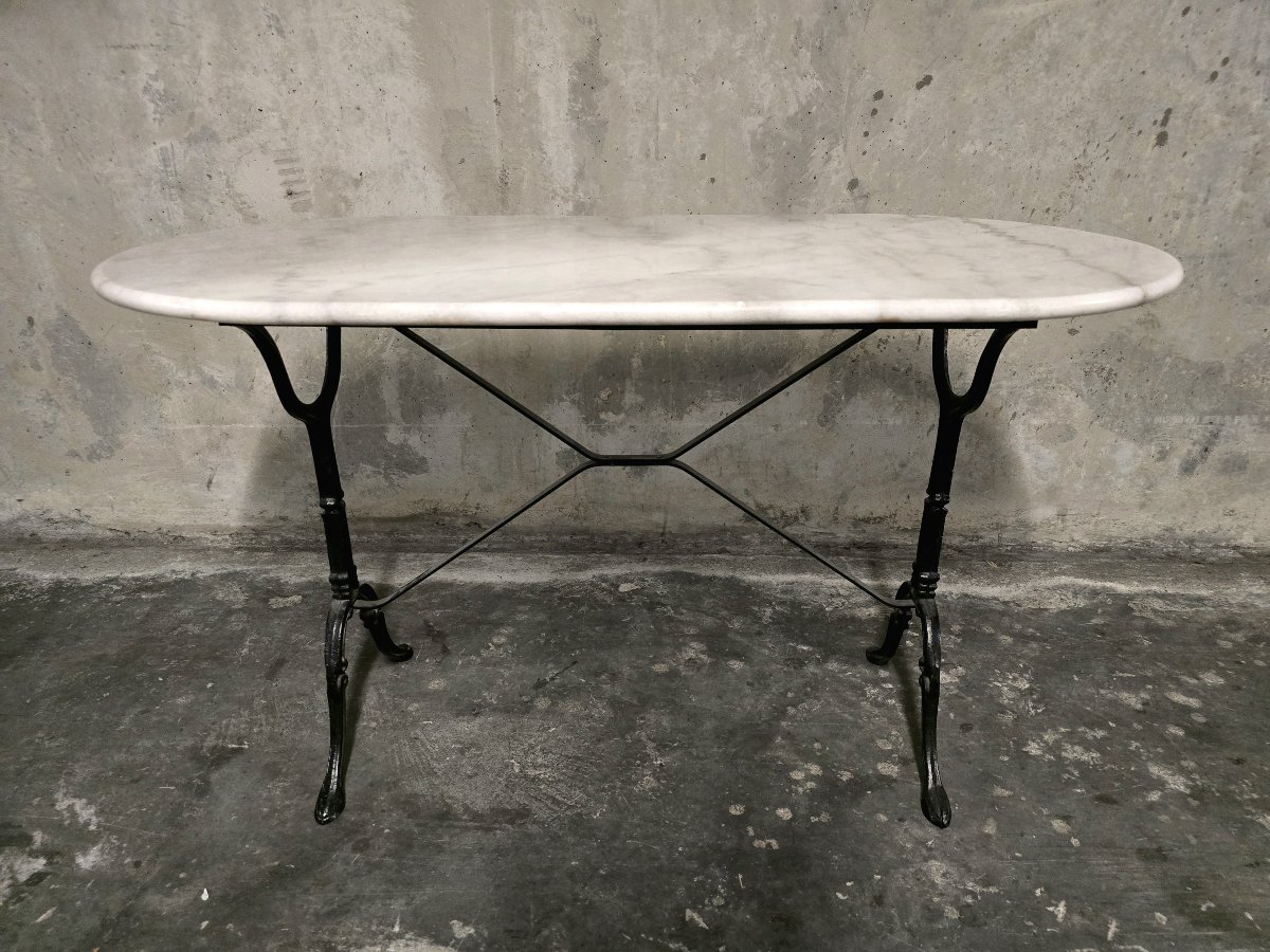 Table bistrot ovale en marbre blanc et piètement en fonte noire - 120 cm  