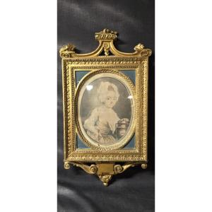 Cadre en bois sculpté et doré, époque Louis XVI