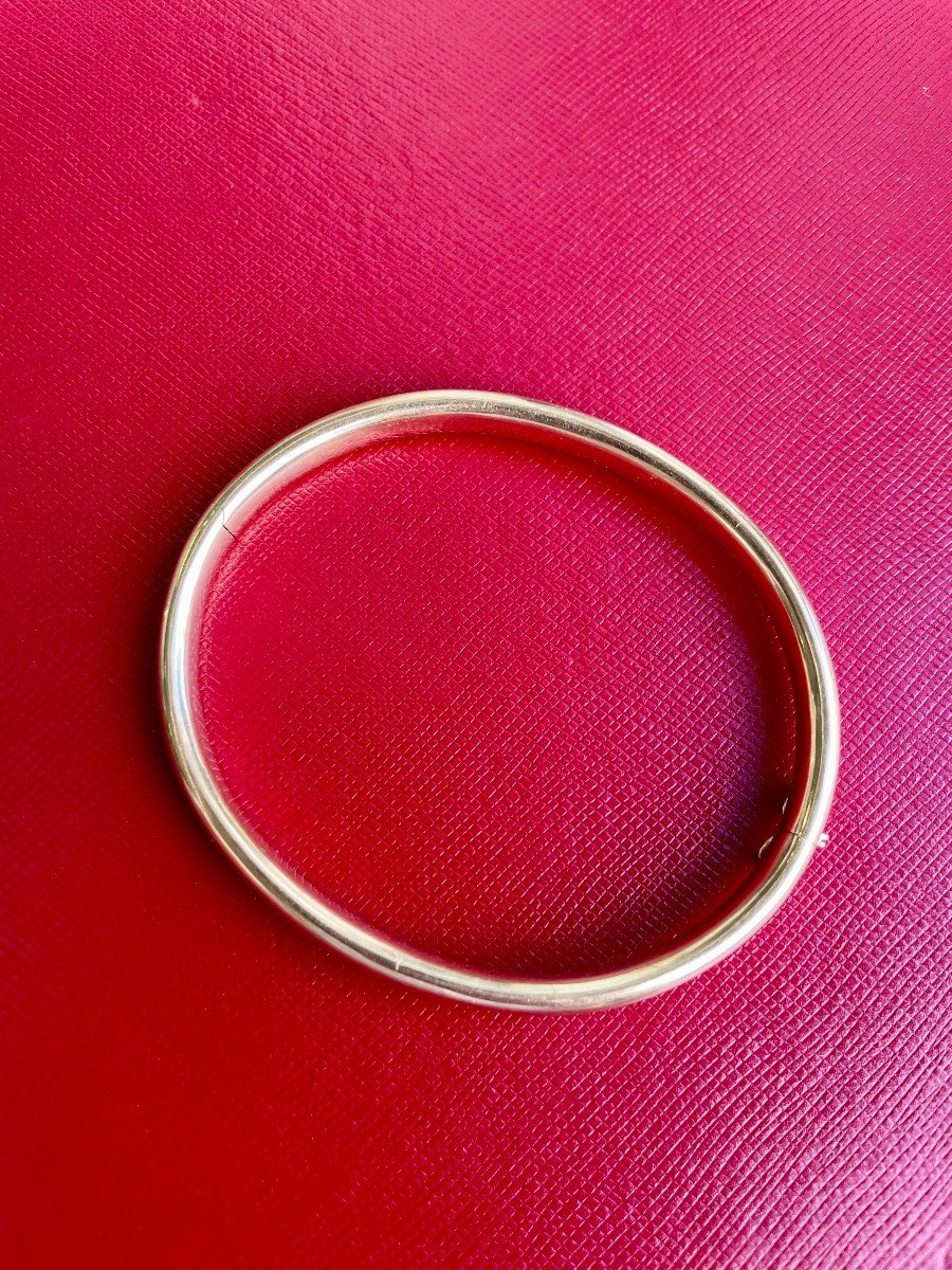 BRACELET jonc ouvrant en or jaune 750/°°° (18K). Fermoir en 8 huit de sécurité.16,66 gr 