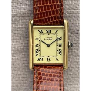 CARTIER Montre bracelet lézard "Must Tank" en vermeil mécanique cadran ivoire chiffres romains 